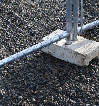 Temporary fence feet. Cement boot for pole.